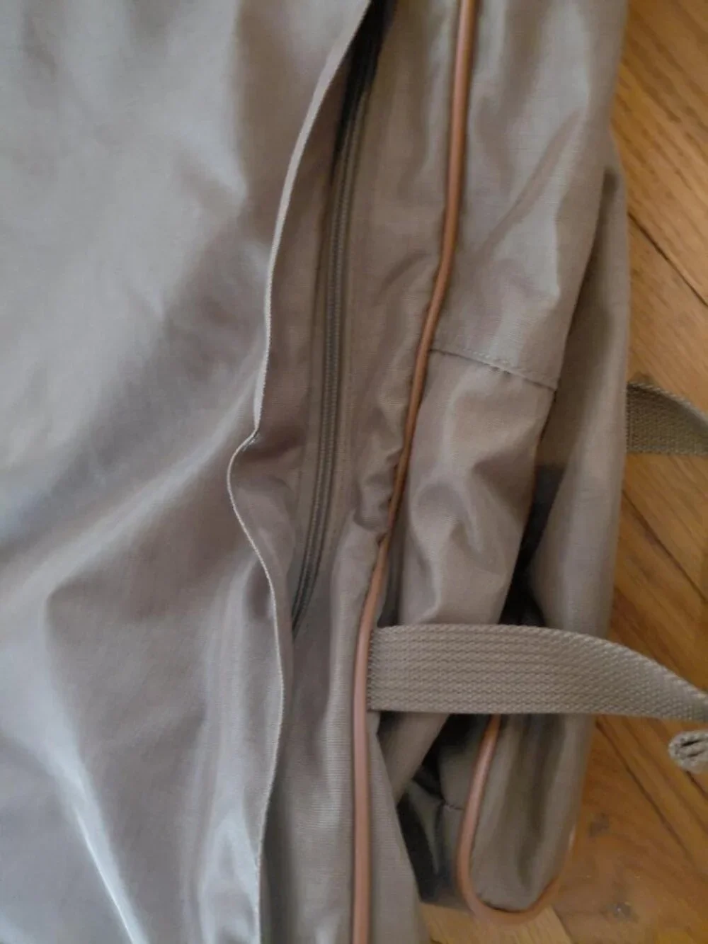 Features 2 deep front pockets with exterior/ interior zipper compartments galore